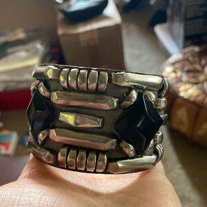 A bracelet with black diamonds